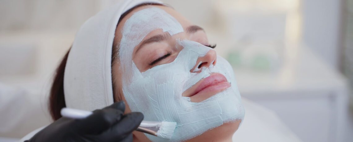 spa and beauty salon woman is enjoying face mask in beauty clinic cosmetologist is app SBI 350583869