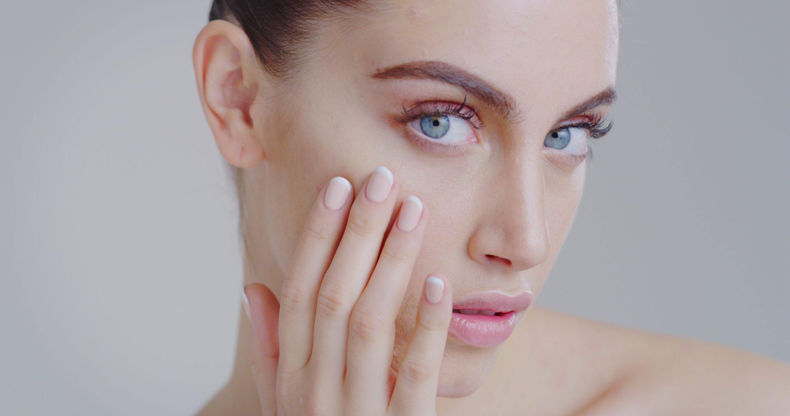 slow motion of woman with beautiful face and perfect skin just cleaned from impurities SBI 350649010