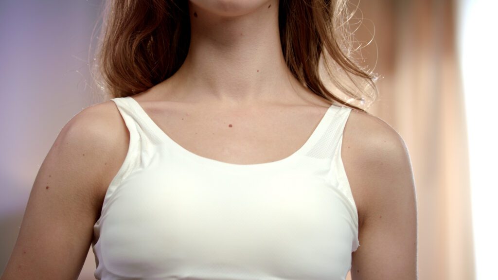 young woman using deodorant roll on armpit close up of beautiful woman body with deodo SBI 350501676